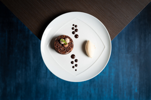 dessert from the restaurant l'Esperance, chocolate tartlet, chocolate dots and Bailey's ice cream quenelle