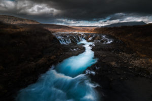turquoise waters of a secret waterfall in iceland